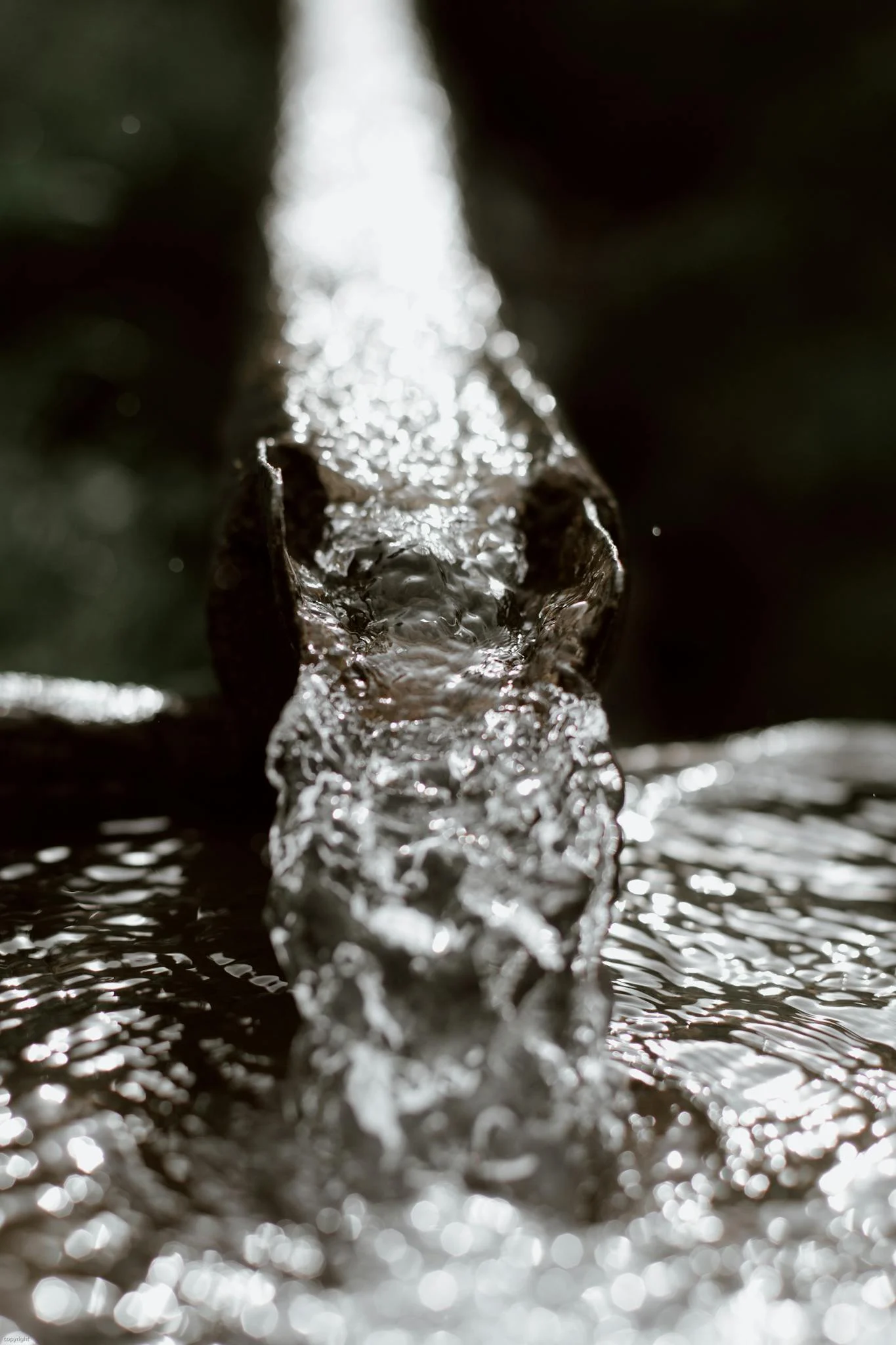 metal rusted drain gutter leading water into